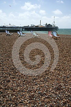 Brighton beach deckchairs palace pier photo