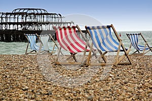 Brighton beach deckchairs west pier sussex england