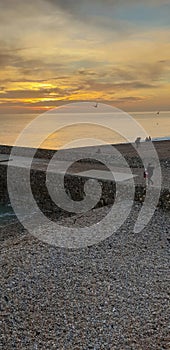 Brighton pier sunset busy Christmas beach pebbles