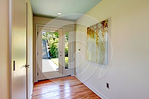 Brightt hallway with glass entrance door