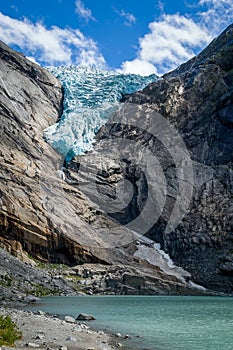 Briksdalsbreen glacier and lake vertical photo