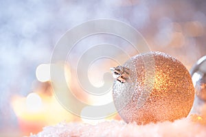 Brilliant ball Christmas decoration in front of blue background