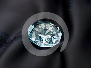 Brilliant blue diamond on a black satin background close up