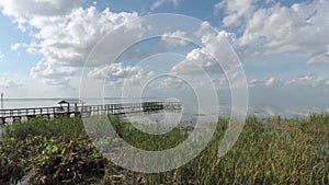 Brilliant blue sky and clouds relect on Lake Apopka at Winter Garden Florida