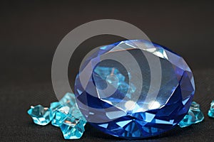 Brilliant cut green diamonds photographed in the studio with a colored background