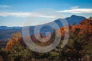 Brilliant fall foliage with Blue Ridge Mountains of South Carolina in distance