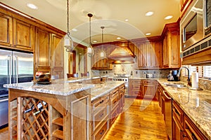 Brilliant kitchen with stained wood cabinets and hardwood floor.