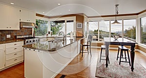 Brilliant kitchen with white accents, and marble counters.