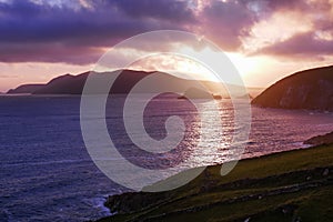 Brilliant sun setting over Great Blasket Island, viewed from Slea Head, Dingle Peninsula, Ireland.