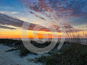 A brilliant sunrise over the sand dunes on Hilton Head Island