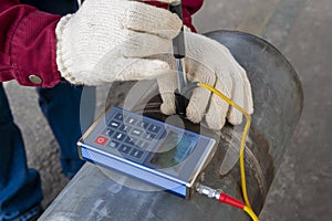 Brinell hardness testing of alloy pipe and welding after a post weld heat treatment & x28;PWHT photo