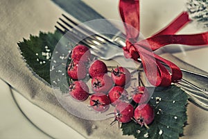 Bring in the New Year dining table place setting with retro vintage and antique silverware in red