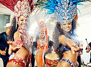 Bringing a rainbow of colors to the Rio Carniva. beautiful samba dancers performing at a carnival.