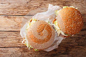 Brioche Cemita Poblana sandwich with meat, cheese and vegetables close-up.  Horizontal top view