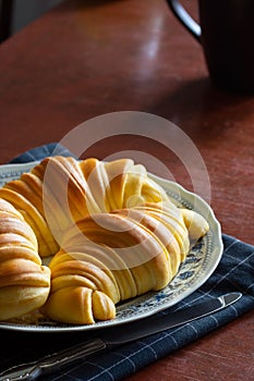 Brioche Croissants, Leavened Portuguese Pastries on Kitchen Table photo