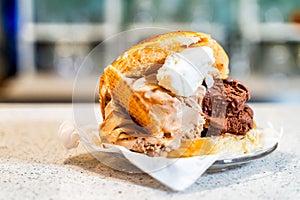 Brioche with ice cream in a Sicilian ice-cream shop photo