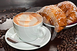 Brioches with cappuccino photo