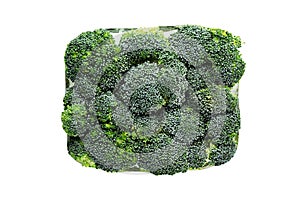 Briquette of fresh frozen green broccoli with hoarfrost closeup on white background.