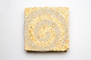 Briquette of pea soup on white background