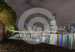 Brisbane city skyline lights across river at night from South Ba