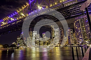 Cityscape night lights reflecting on Brisbane River photo