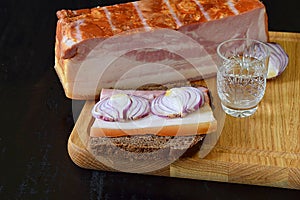 Brisket, brisket and onion sandwich and a glass of vodka
