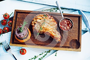 Brisket with sauce on a wooden board