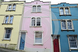 Narrow street with colorful houses in Eastville neighborhood in Bristol city