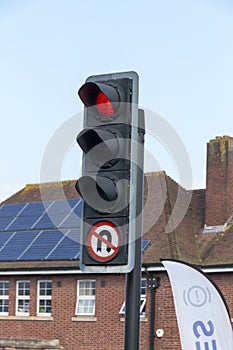 A close up view of a red robot or traffic light photo