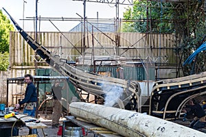 Men building an unusal designed boat in Bristol on May 14, 2019. Three unidentified men