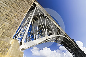 Britannia Bridge and a section of a steel arch which spans the Menai Strait, Anglesey, Gwynedd, North Wales