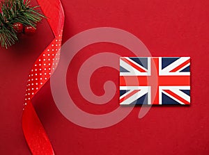 British Christmas tradition and holiday design concept. Union Jack flag of Great Britain and xmas ornaments and