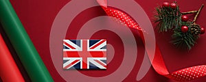 British Christmas tradition and holiday design concept. Union Jack flag of Great Britain and xmas ornaments and