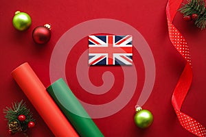 British Christmas tradition and holiday design concept. Union Jack flag of Great Britain and xmas ornaments and