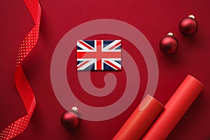 British Christmas tradition and holiday design concept. Union Jack flag of Great Britain and xmas ornaments and