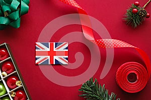 British Christmas tradition and holiday design concept. Union Jack flag of Great Britain and xmas ornaments and