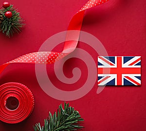 British Christmas tradition and holiday design concept. Union Jack flag of Great Britain and xmas ornaments and