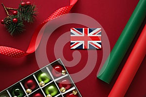 British Christmas tradition and holiday design concept. Union Jack flag of Great Britain and xmas ornaments and