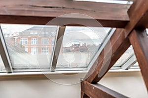 British city view through roof window glass in England