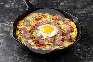 A British Classic, Bubble and Squeak baked with mashed potatoes with cabbage, bacon and eggs