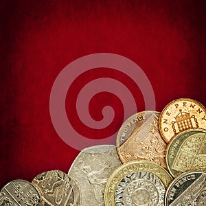 British Coins over Red Grunge Background