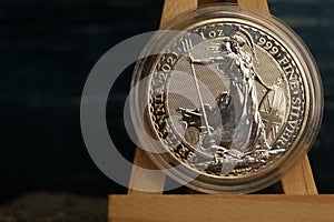 British fine silver coin in capsule. 2 Pounds Britania 1oz 2021 cose-up.