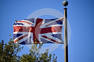 British Flag against a blue sky. Yorktown, VA, USA.