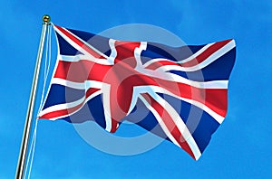 British flag, United Kingdom flag on the blue sky background. 3D illustration