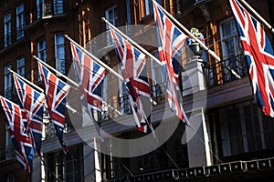 British flags in sunshine in central London