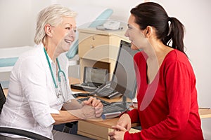 British GP talking to woman patient