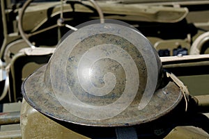 British helmet of World War II on the jeep