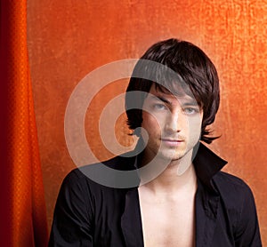 British indie pop rock look young man on orange photo