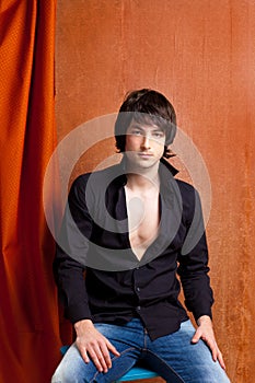 British indie pop rock look young man on orange photo