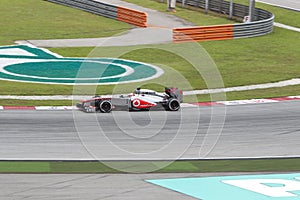 Jenson Button enters turn 1 at Malaysian F1 GP